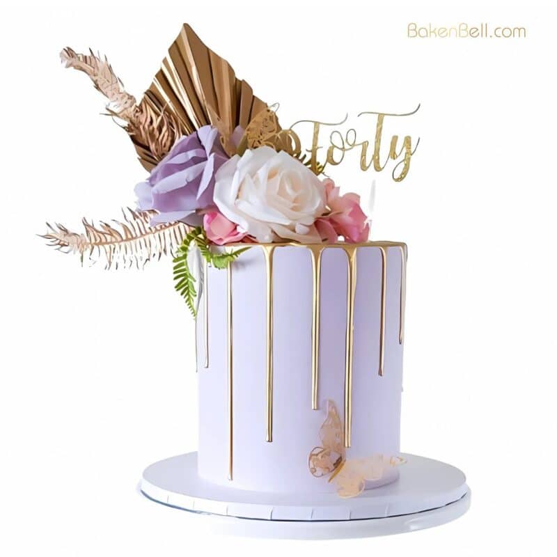 Embrace elegance and charm with our Floral Golden Drip Cake—a perfect blend of beauty and taste. This enchanting cake features soft, pastel layers adorned with a luxurious golden drip that adds a touch of glamour. Delicately decorated with fresh blooms and edible floral accents, it brings a romantic, garden-inspired feel to any celebration. Ideal for weddings, birthdays, or any occasion that deserves something extra special, this cake is not only a treat for the taste buds but also a feast for the eyes.