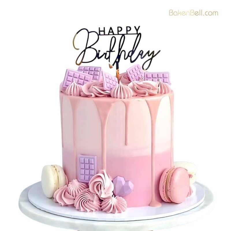 Strawberry Macaron Cake with loaded chocolate cubes and dripping white chocolate